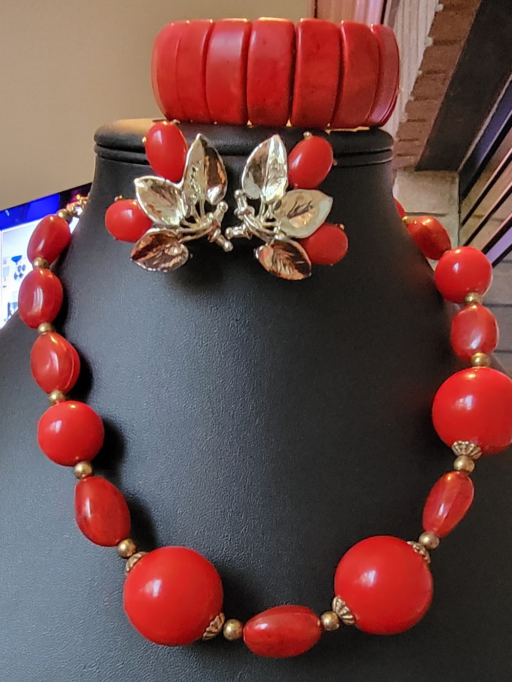 Stunning red jewelry set includes a beaded necklace, clip earrings, and bracelet